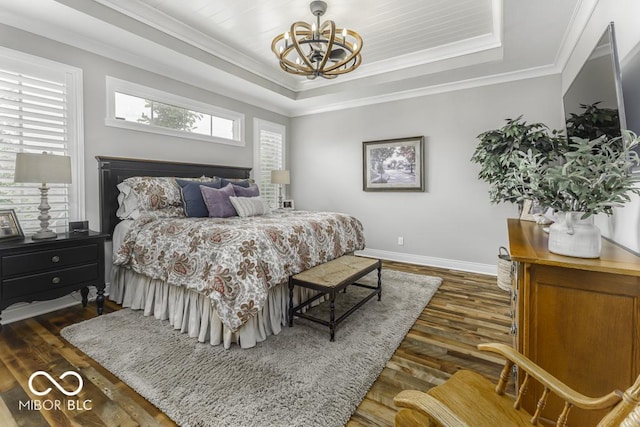 7648 Killarney Dr, Indianapolis, IN 46217 - bedroom featuring a chandelier, dark wood-type flooring, a raised ceiling, baseboards, and crown molding