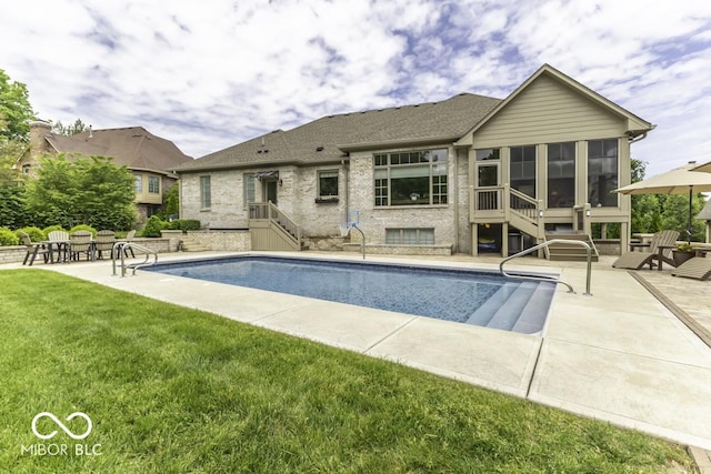 7648 Killarney Dr, Indianapolis, IN 46217 - outdoor pool with a sunroom, a patio, and a yard
