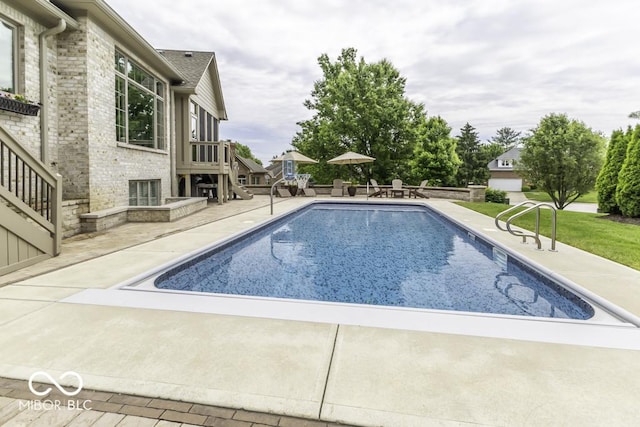 7648 Killarney Dr, Indianapolis, IN 46217 - outdoor pool with a patio, stairway, and a yard