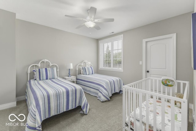 7648 Killarney Dr, Indianapolis, IN 46217 - bedroom with carpet floors, baseboards, and a ceiling fan