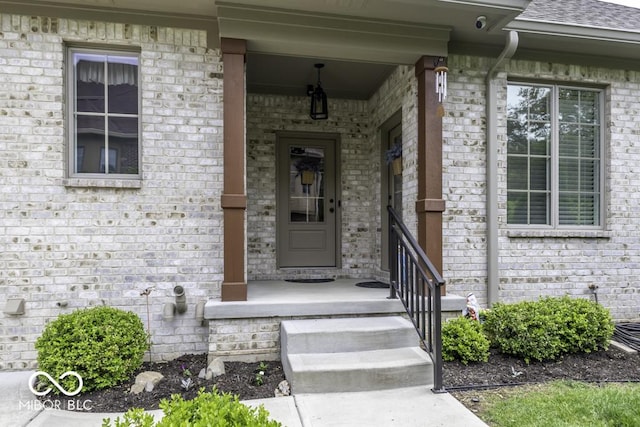 7648 Killarney Dr, Indianapolis, IN 46217 - doorway to property featuring brick siding and roof with shingles
