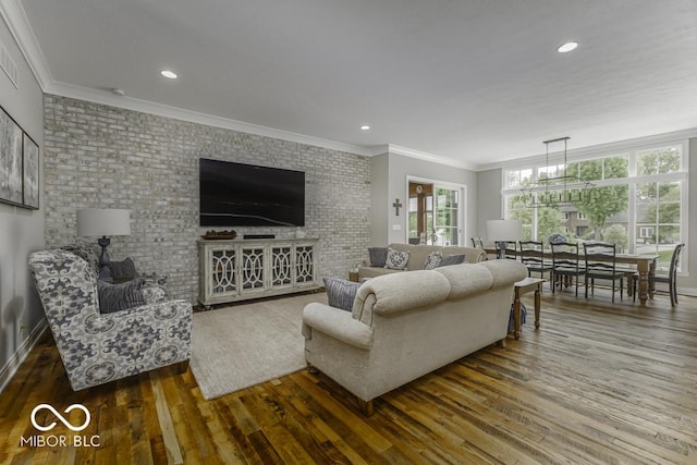 7648 Killarney Dr, Indianapolis, IN 46217 - living area featuring wood finished floors, crown molding, brick wall, and recessed lighting