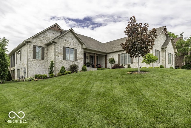 7648 Killarney Dr, Indianapolis, IN 46217 - view of front of house featuring brick siding and a front lawn