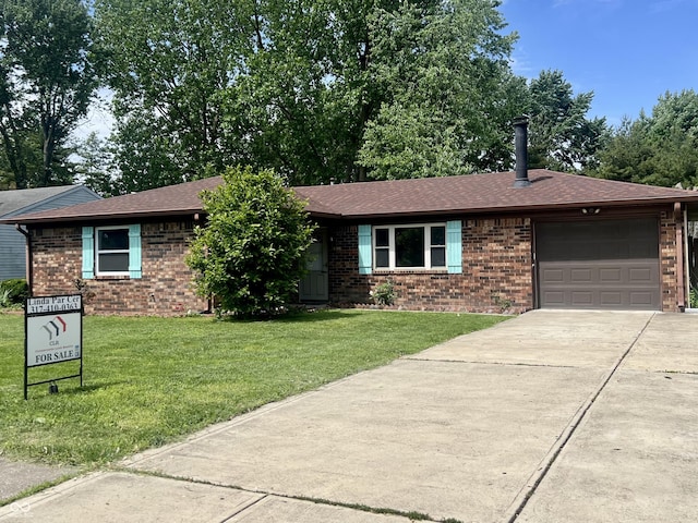 7824 Hearthstone Way, Indianapolis, IN 46227 - ranch-style home featuring brick siding, concrete driveway, and a front lawn