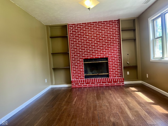 7824 Hearthstone Way, Indianapolis, IN 46227 - unfurnished living room with built in shelves, wood finished floors, and baseboards