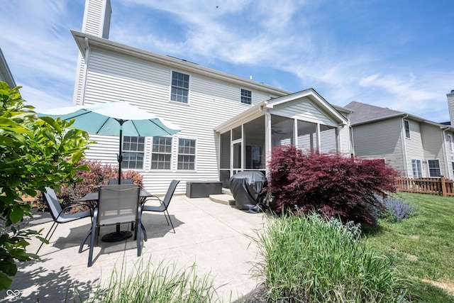 12093 Ashland Dr, Fishers, IN 46037 - rear view of property with a patio, a sunroom, and outdoor dining space