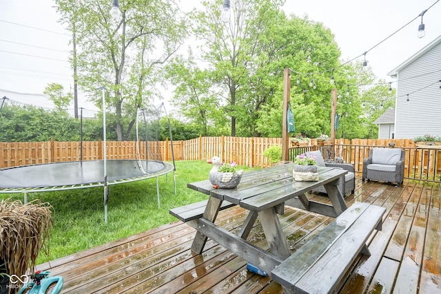 5374 John Quincy Adams Ct, Plainfield, IN 46168 - wooden deck with a trampoline and outdoor dining area