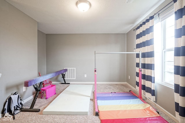 5374 John Quincy Adams Ct, Plainfield, IN 46168 - rec room featuring carpet floors, baseboards, and a textured ceiling