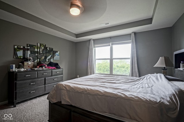 5374 John Quincy Adams Ct, Plainfield, IN 46168 - bedroom with light carpet, a tray ceiling, and a ceiling fan