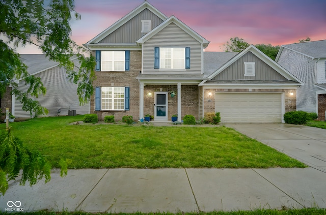 5374 John Quincy Adams Ct, Plainfield, IN 46168 - view of front of property featuring board and batten siding, brick siding, driveway, and a garage