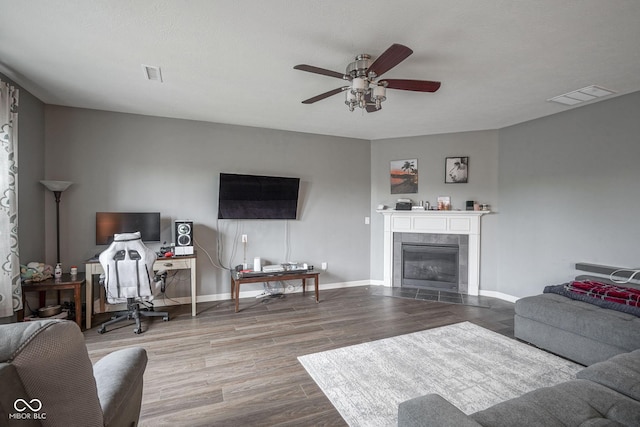5374 John Quincy Adams Ct, Plainfield, IN 46168 - living area with a ceiling fan, wood finished floors, a tile fireplace, and baseboards