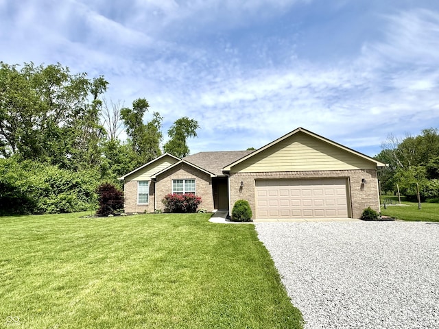 252 Patriots Lndg, Fillmore, IN 46128 - single story home featuring gravel driveway, an attached garage, a front lawn, and brick siding