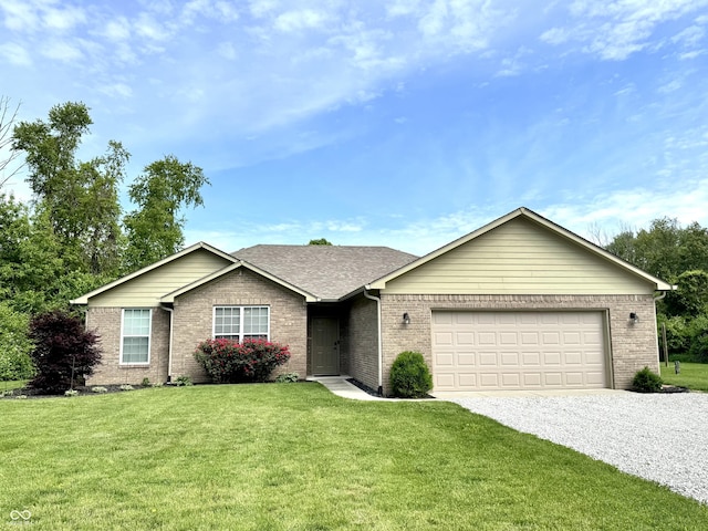 252 Patriots Lndg, Fillmore, IN 46128 - ranch-style house featuring gravel driveway, an attached garage, brick siding, a front yard, and a shingled roof