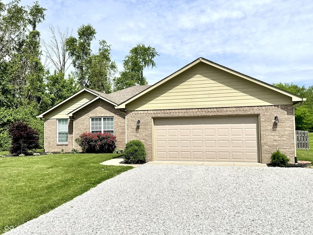 252 Patriots Lndg, Fillmore, IN 46128 - ranch-style home with brick siding, driveway, a front yard, and an attached garage