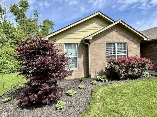 252 Patriots Lndg, Fillmore, IN 46128 - view of side of property with brick siding and a lawn