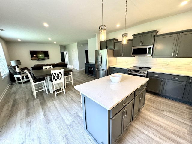 252 Patriots Lndg, Fillmore, IN 46128 - kitchen featuring stainless steel appliances, open floor plan, light countertops, tasteful backsplash, and recessed lighting