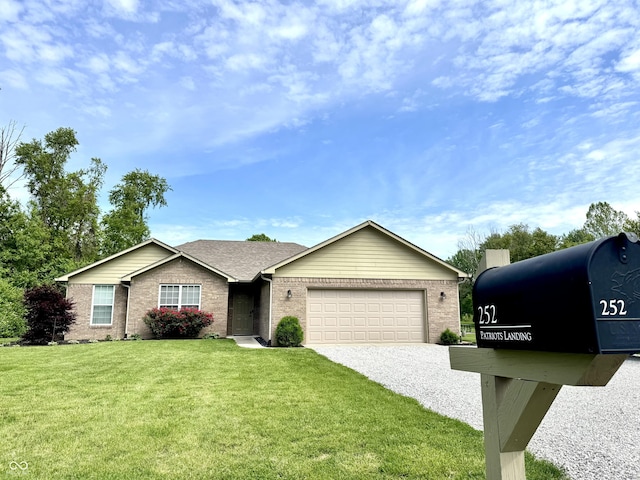 252 Patriots Lndg, Fillmore, IN 46128 - ranch-style home with gravel driveway, brick siding, a garage, and a front yard