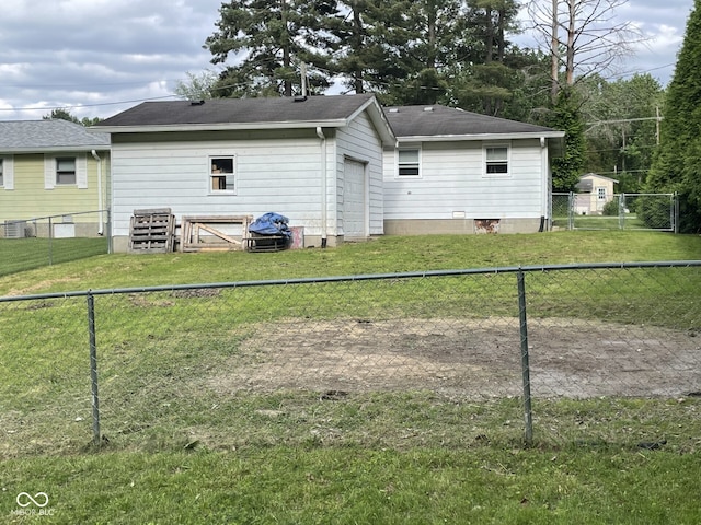 back of house with roof with shingles