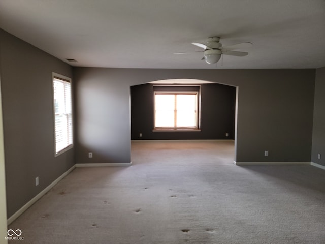 11754 Hamble Dr, Indianapolis, IN 46235 - carpeted empty room with ceiling fan and arched walkways