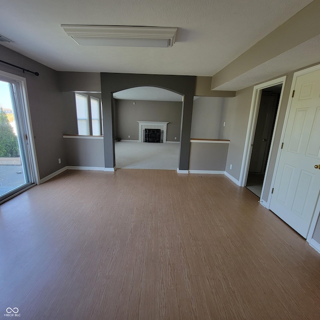 11754 Hamble Dr, Indianapolis, IN 46235 - unfurnished living room with wood finished floors and a fireplace