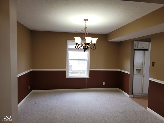 11754 Hamble Dr, Indianapolis, IN 46235 - unfurnished room with light colored carpet and a chandelier