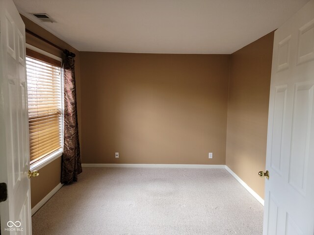 11754 Hamble Dr, Indianapolis, IN 46235 - spare room with baseboards and light carpet
