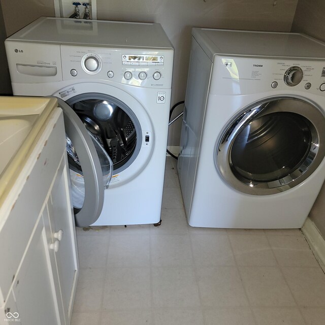 11754 Hamble Dr, Indianapolis, IN 46235 - washroom featuring washer and clothes dryer and tile patterned floors