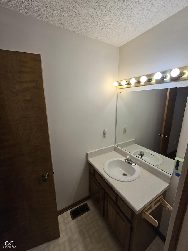 1805 River Run Trl, Fort Wayne, IN 46825 - bathroom featuring a textured ceiling, vanity, and tile patterned floors