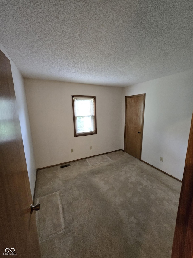 1805 River Run Trl, Fort Wayne, IN 46825 - empty room with baseboards, carpet, and a textured ceiling