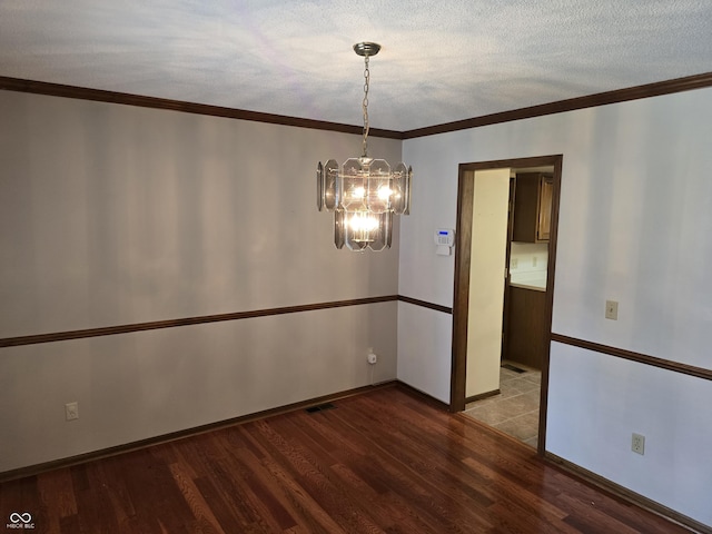 1805 River Run Trl, Fort Wayne, IN 46825 - empty room with a chandelier, wood finished floors, crown molding, baseboards, and a textured ceiling