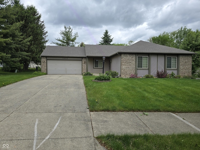 1805 River Run Trl, Fort Wayne, IN 46825 - ranch-style house with brick siding, an attached garage, and a front yard