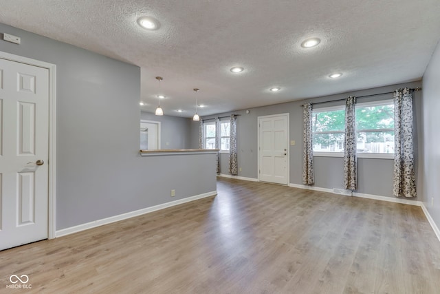 521 Elmhurst Pl, Whiteland, IN 46184 - unfurnished room with a textured ceiling, wood finished floors, baseboards, and recessed lighting