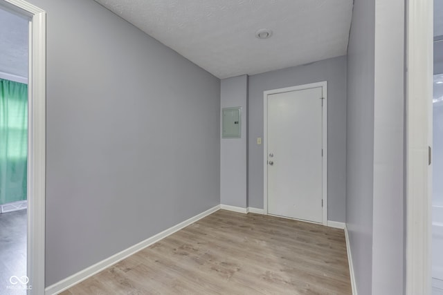 521 Elmhurst Pl, Whiteland, IN 46184 - foyer with electric panel, light wood-type flooring, baseboards, and a textured ceiling