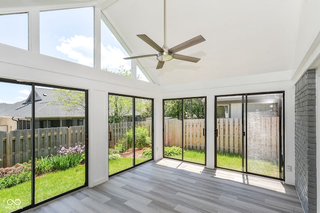 12289 Charing Cross Rd, Carmel, IN 46033 - unfurnished sunroom featuring a ceiling fan, wood finished floors, and high vaulted ceiling