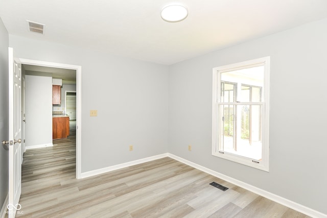 12289 Charing Cross Rd, Carmel, IN 46033 - spare room with light wood-type flooring and baseboards