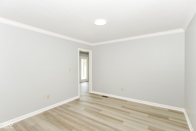12289 Charing Cross Rd, Carmel, IN 46033 - spare room featuring ornamental molding, light wood-style flooring, and baseboards