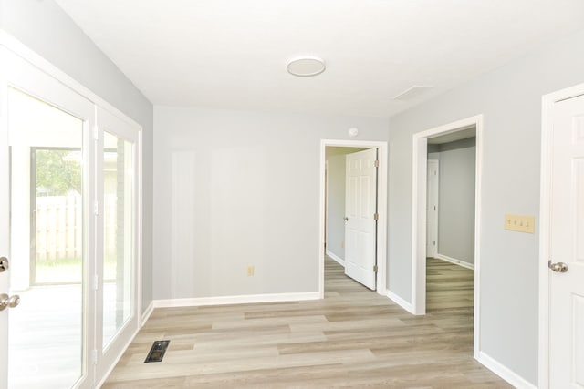 12289 Charing Cross Rd, Carmel, IN 46033 - unfurnished room featuring light wood finished floors and baseboards