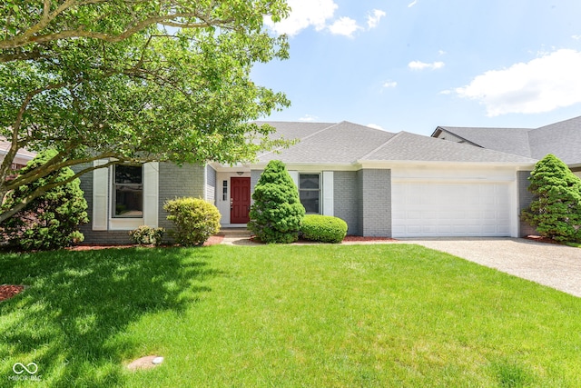 12289 Charing Cross Rd, Carmel, IN 46033 - view of front of house with brick siding, an attached garage, a front lawn, and concrete driveway