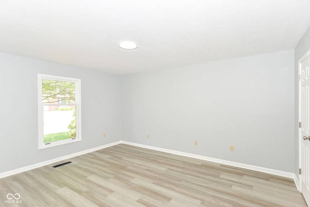 12289 Charing Cross Rd, Carmel, IN 46033 - spare room featuring light wood finished floors and baseboards
