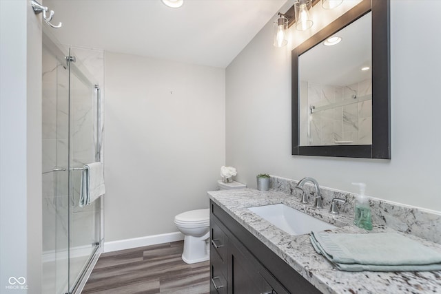 16071 Prince Ct, Noblesville, IN 46062 - full bath featuring vanity, a marble finish shower, toilet, wood finished floors, and baseboards