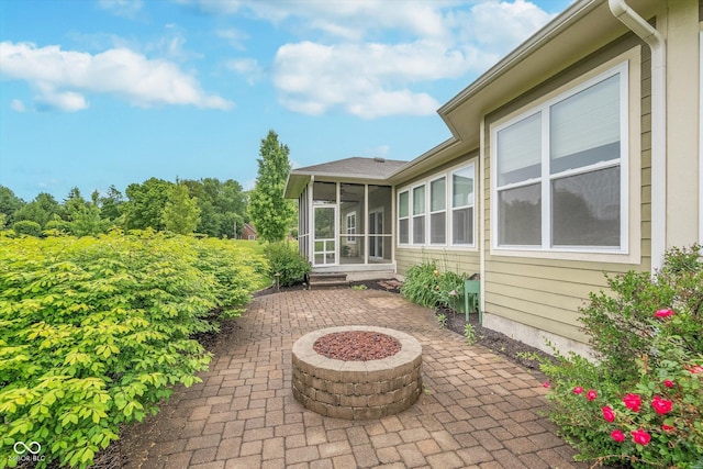 16071 Prince Ct, Noblesville, IN 46062 - view of patio / terrace featuring a sunroom and an outdoor fire pit