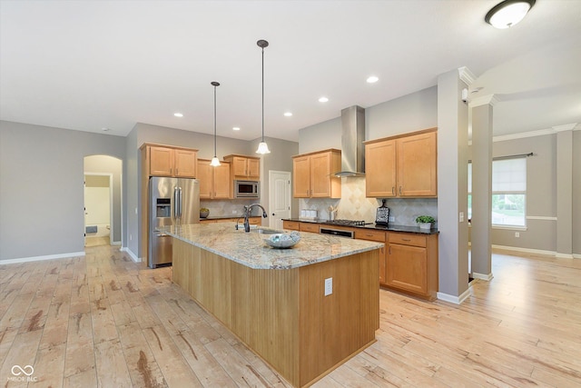 16071 Prince Ct, Noblesville, IN 46062 - kitchen featuring stainless steel appliances, wall chimney range hood, a sink, baseboards, and recessed lighting