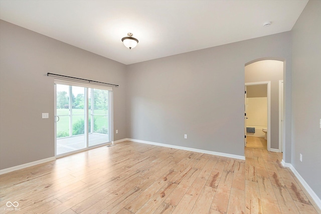 16071 Prince Ct, Noblesville, IN 46062 - spare room with arched walkways, light wood-type flooring, baseboards, and a smoke detector