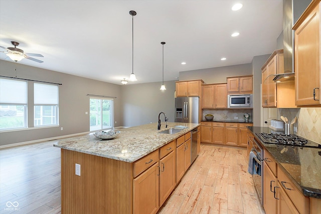 16071 Prince Ct, Noblesville, IN 46062 - kitchen featuring appliances with stainless steel finishes, a sink, light wood finished floors, ceiling fan, and recessed lighting