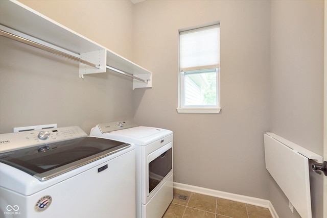 16071 Prince Ct, Noblesville, IN 46062 - laundry room with washing machine and dryer, baseboards, and light tile patterned flooring