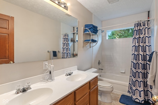 7978 Park Meadows Dr, Brownsburg, IN 46112 - full bath with toilet, shower / tub combo, double vanity, tile patterned flooring, and a textured ceiling