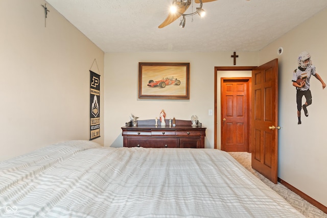 7978 Park Meadows Dr, Brownsburg, IN 46112 - bedroom featuring light carpet, a textured ceiling, a ceiling fan, and baseboards
