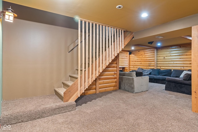 7978 Park Meadows Dr, Brownsburg, IN 46112 - living room with rustic walls, carpet flooring, stairs, and recessed lighting