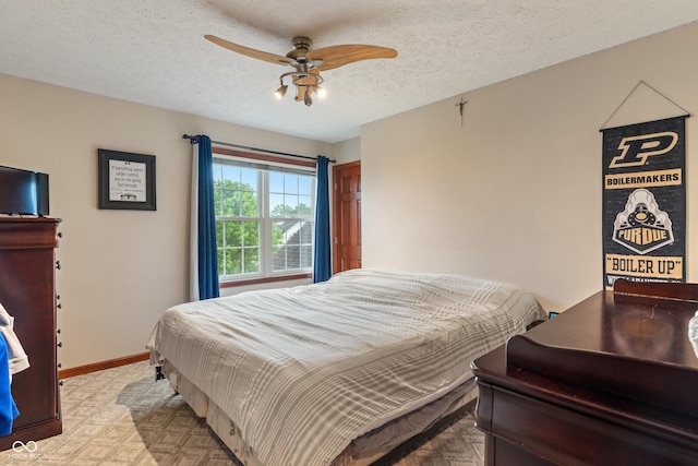 7978 Park Meadows Dr, Brownsburg, IN 46112 - bedroom featuring baseboards, a textured ceiling, and a ceiling fan