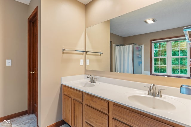 7978 Park Meadows Dr, Brownsburg, IN 46112 - bathroom with double vanity, a shower with curtain, and baseboards